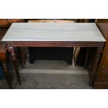 A marble top console table on mahogany base with turned and reeded supports, 122 cm wide x 51 cm