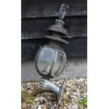 Antique metal large coach-lamp, surmounted by a cast angel on crown, the shade with foliate-etched