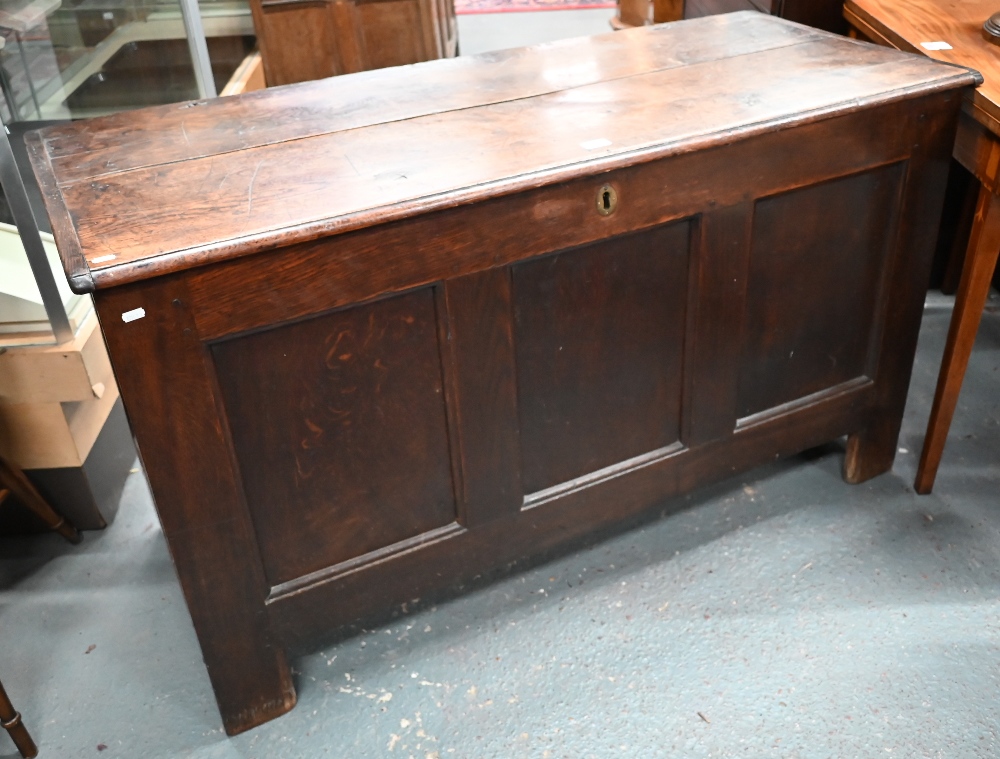 A large antique panelled oak coffer, hinged top enclosing the deep storage area, 138 cm wide x 56 cm - Image 2 of 5