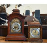 An Elliott, London walnut cased brass mounted mantel clock with twin-train movement striking on a