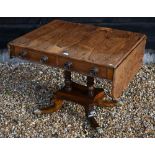 A Regency rosewood sofa table (damaged leaf) with two drawers and concaved platform base with