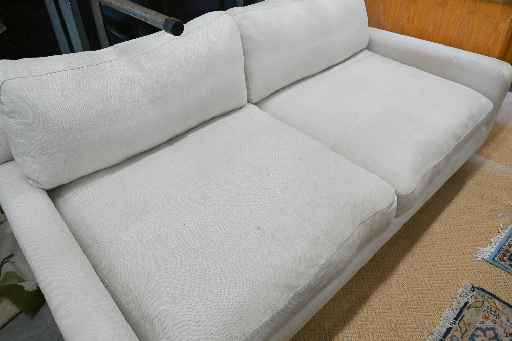 A Loaf Banoffee sofa, cream woven linen upholstery and turned light oak tapering legs, 210 cm w x - Image 3 of 4