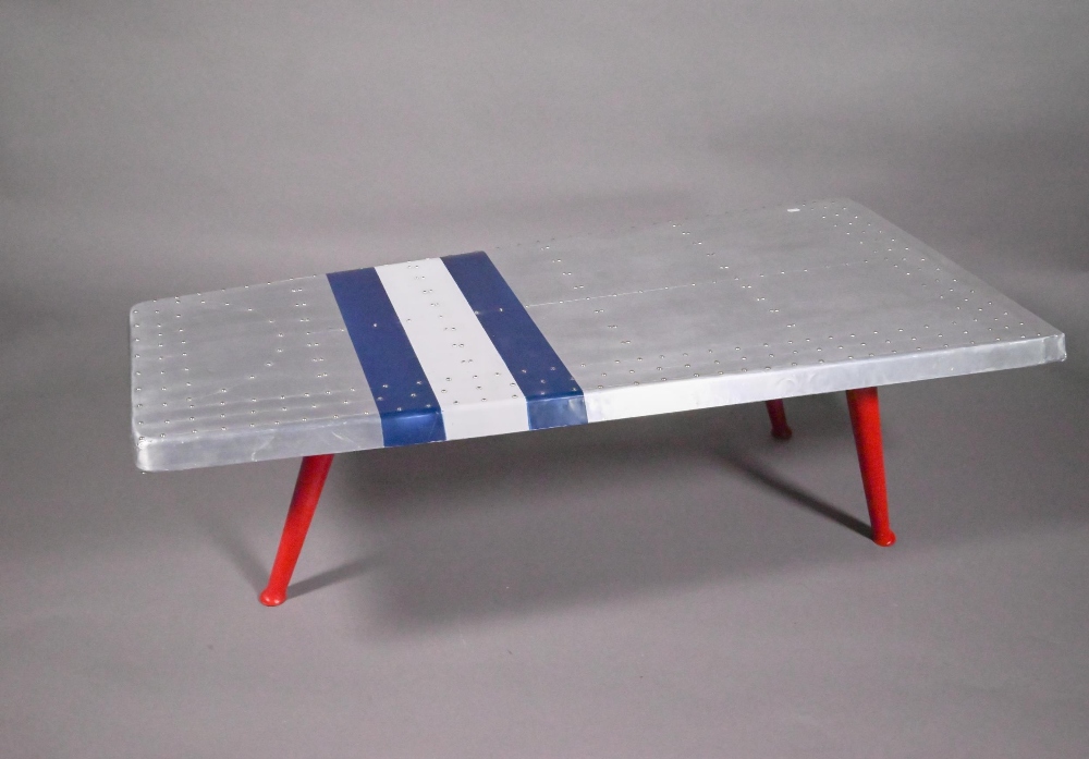 A rivetted vintage alloy aeroplane wing style tripod coffee table