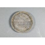 An Edwardian silver medal 'First Prize Bakery Competition London Exhibition 1905', 'Presented by the