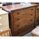 A large Victorian mahogany chest of four long graduating drawers with turned handles, raised on