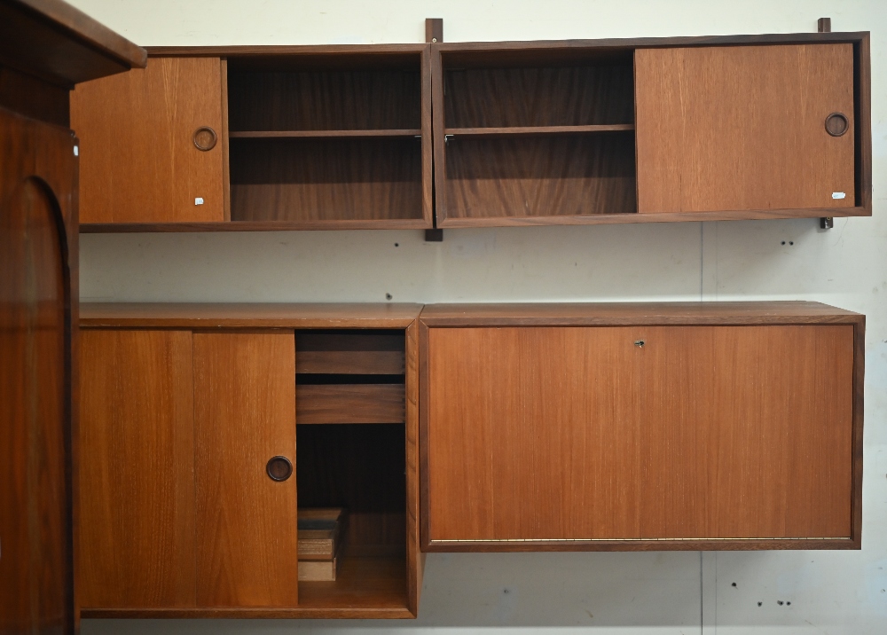 Seven various Danish design teak modular wall cabinets including drawers and cupboards, all as found