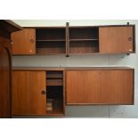 Seven various Danish design teak modular wall cabinets including drawers and cupboards, all as found