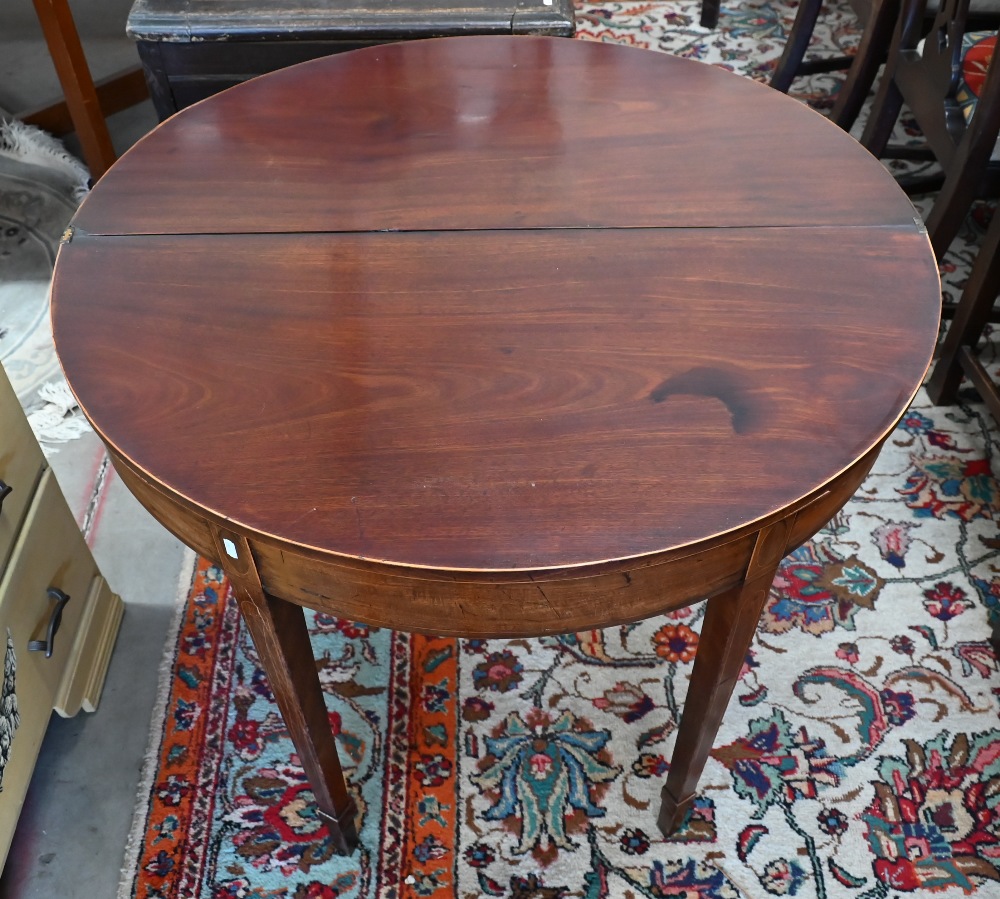 A 19th century mahogany demi-lune tea table on tapering square supports with tall spade feet, 90 - Image 2 of 2