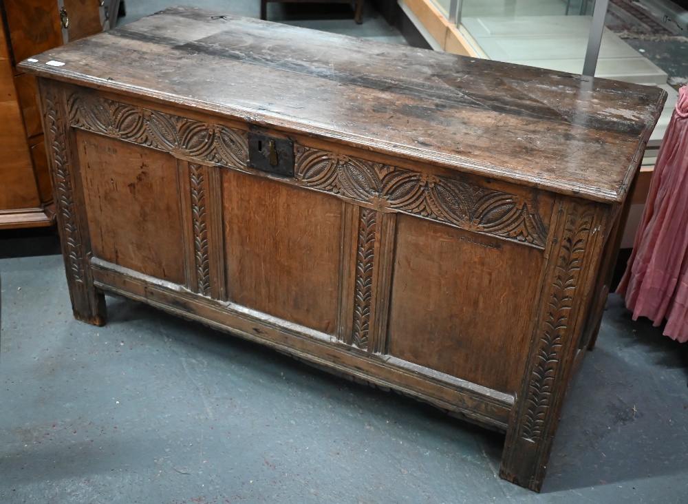 An antique carved and panelled oak coffer, 132 cm wide x 58 cm deep x 72 cm high - Image 2 of 5