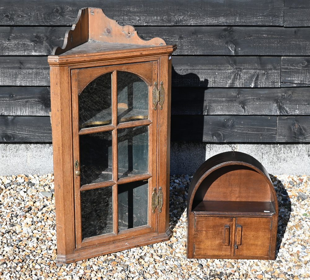 An antique provincial oak corner cupboard with glazed door, 102 cm high (a/f) to/w a small oak