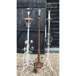 Two antique wrought iron/steel standard lamps, converted from an oil lamp and later painted, to/w