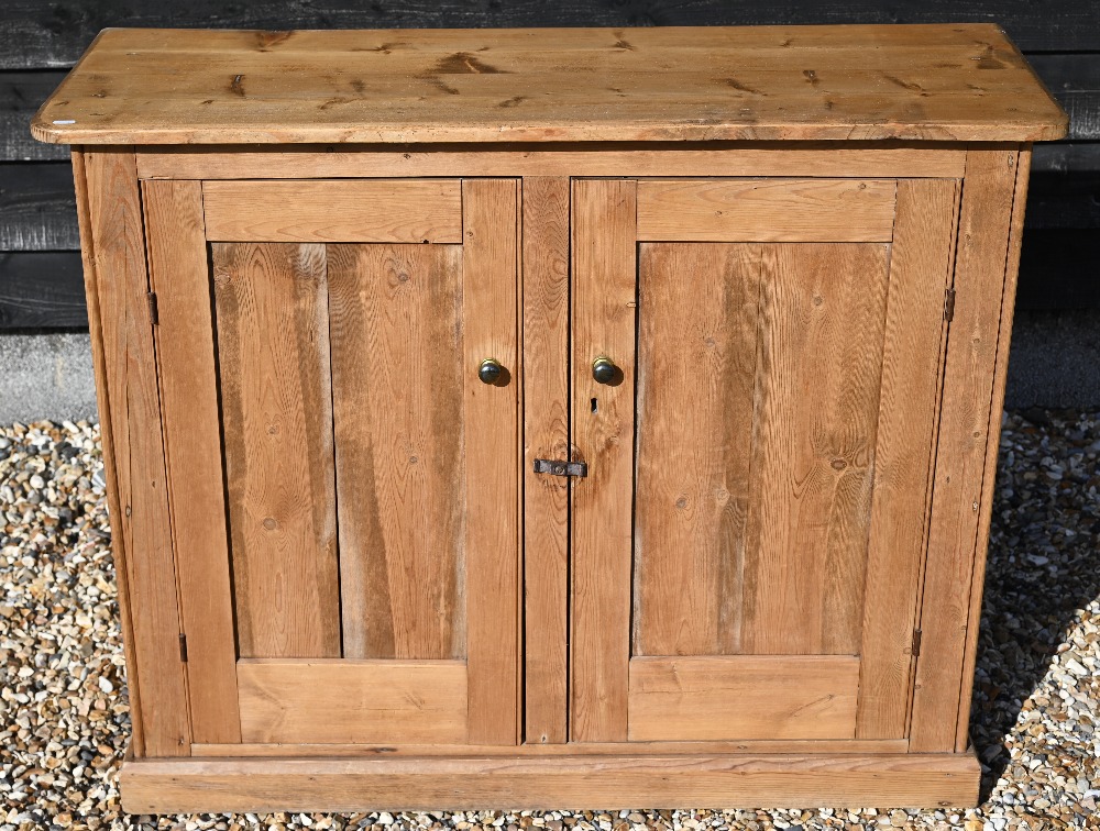 A waxed pine hall cupboard with panelled doors, 116 cm wide x 44 cm deep x 94 cm high - Image 3 of 3