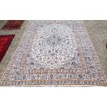 Large Persian Kashan carpet, traditional scrolling floral design on cream ground within palmette