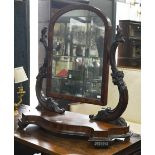 A large Victorian mahogany toilet mirror raised on a serpentine platform base on scroll feet, 67 x