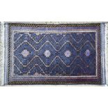 Persian Baluchi rug, geometric design in brown on indigo ground, narrow borders and kelim ends,