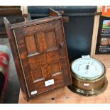 A small oak-panelled wall-mounting medicine cabinet 35 x 21 cm to/w a brass-cased ship's bulkhead