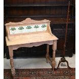 An Edwardian stripped pine wash stand with galleried back and Art Nouveau floral tiles, 92 cm wide x