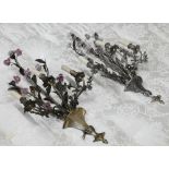 A matched pair of floral and foliate cast three branch metal sconces with ceramic flowers, 75 cm