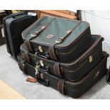 A graduated set of three Antler suitcases, to/w a similar carry-on case (4)