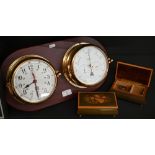 Marine clock and aneroid barometer in brass drum cases, mounted on teak plaque, 45 cm wide overall