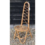 A vintage bamboo chair in the style of Dirk Van Sliedregt, to/w a child's vintage wicker chair and a