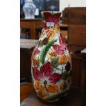 A large Continental foliate-painted pottery vase, 49 cm