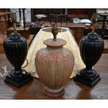 A pair of black ceramic lamp bases in the form of classical urns by Wedgwood for Jane Churchill,