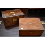 A Victorian mahogany and brass mounted writing box opening to reveal a fitted interior with black