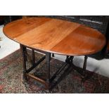 An antique mahogany oval drop leaf dining table, 105 x 55 (150 open) x 75 cm h
