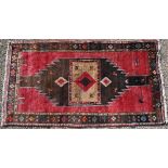 A Persian Hamadan kelleigh with geometric design on red ground with dark brown border, 279 x 156 cm