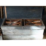 A collection of antique moulding planes and turning-chisels, in stained pine chest