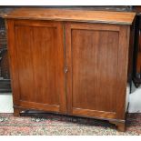 A Victorian mahogany side cabinet with pair of panelled doors enclosing single shelf, raised on