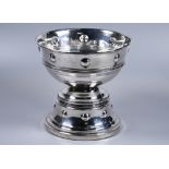 Edwardian Arts & Crafts silver trophy bowl with repoussé bosses to the waist and base, on loaded