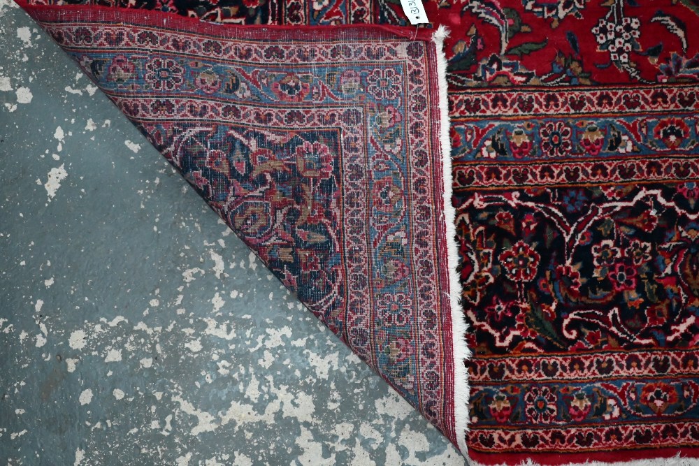 A fine old Persian hand-made Kashan carpet, the red ground with repeating linked garden vine design, - Image 5 of 12