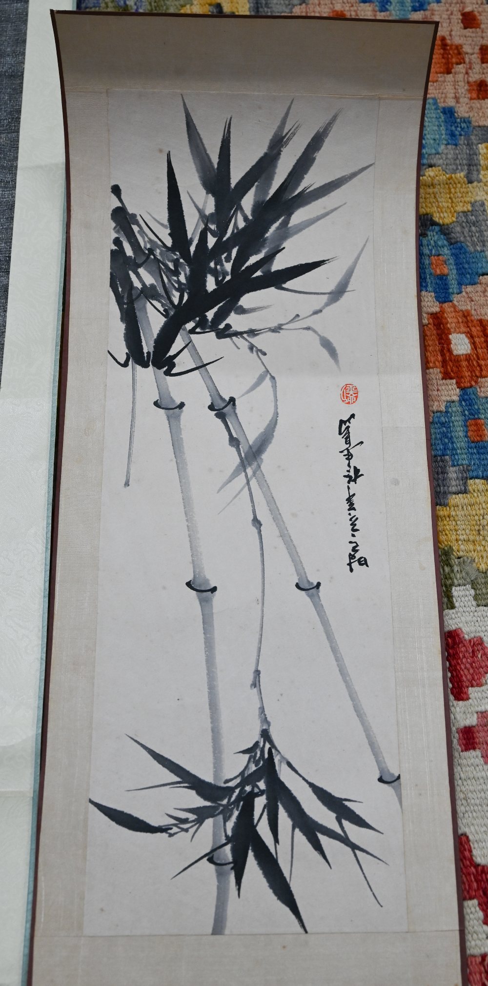 A Singaporean traditional hand scroll painting, ink and colour on silk with a figure walking through - Image 6 of 8