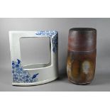 A Japanese cylindrical Raku style vase with irregular brown, bronze and copper lead glazed exterior,