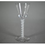 A Georgian cordial glass with plain tapering bowl on opaque double-twist stem and flattened foot, 14