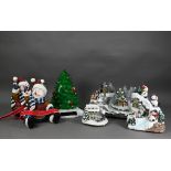 Six various modern decorative Christmas arrangements, including tree, snowman, villages etc