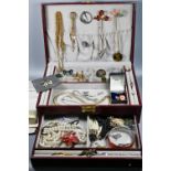 A jewel case containing vintage and later jewellery including brooches, pearls, beads, bangle etc