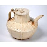A Chinese Northern Song style teapot and cover with crackled cream-glaze and relief decoration, 20th