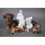 Large Royal Copenhagen Dachshund puppy 856 to/w four smaller puppies, 3140/3169/1407/1408; lot