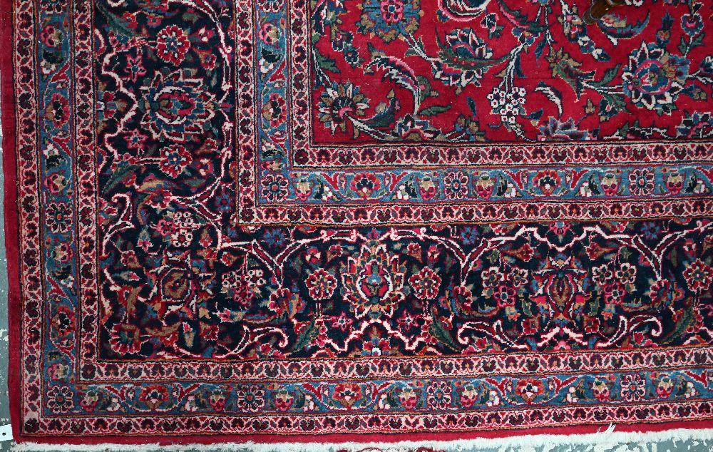 A fine old Persian hand-made Kashan carpet, the red ground with repeating linked garden vine design, - Image 11 of 12