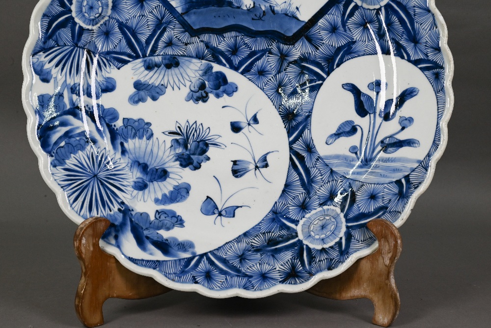 A 19th century Japanese blue and white floriform charger, painted with a goose and bamboo within a - Image 3 of 10