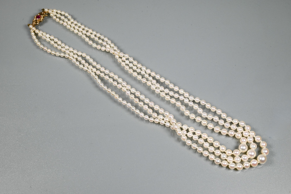 A triple row of graduated cultured pearls double knotted throughout onto ruby and pearl set snap, - Image 2 of 5