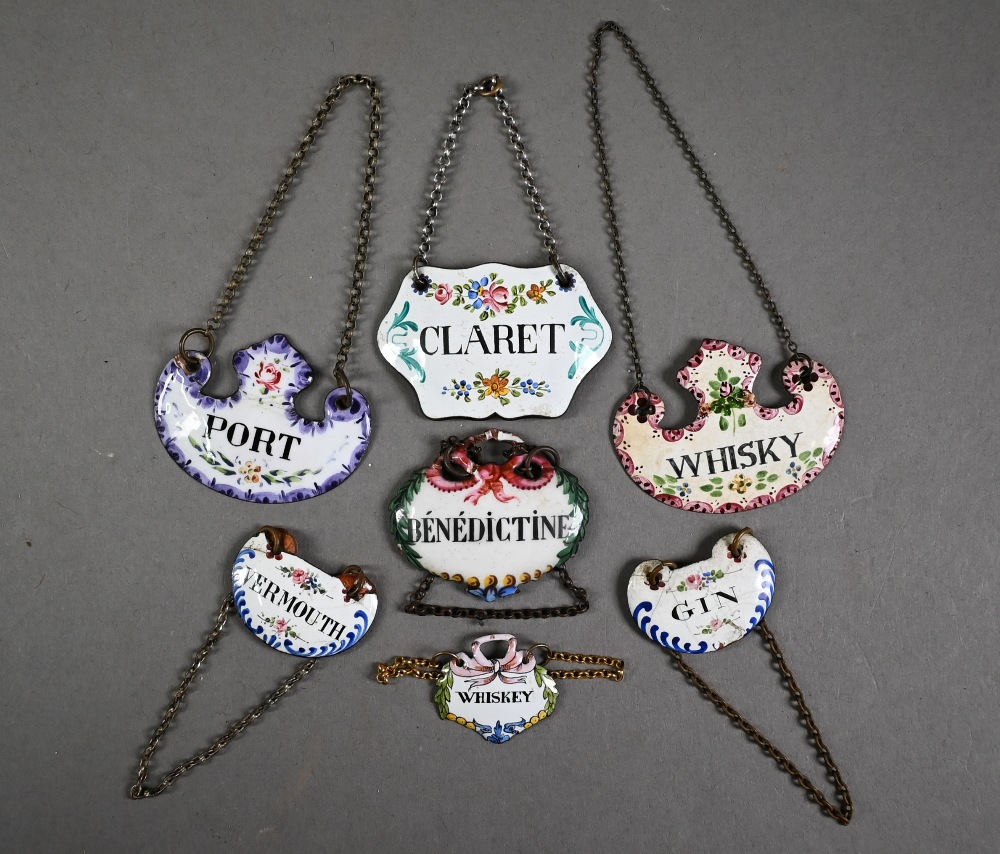 Collection of seven various antique enamel decanter labels