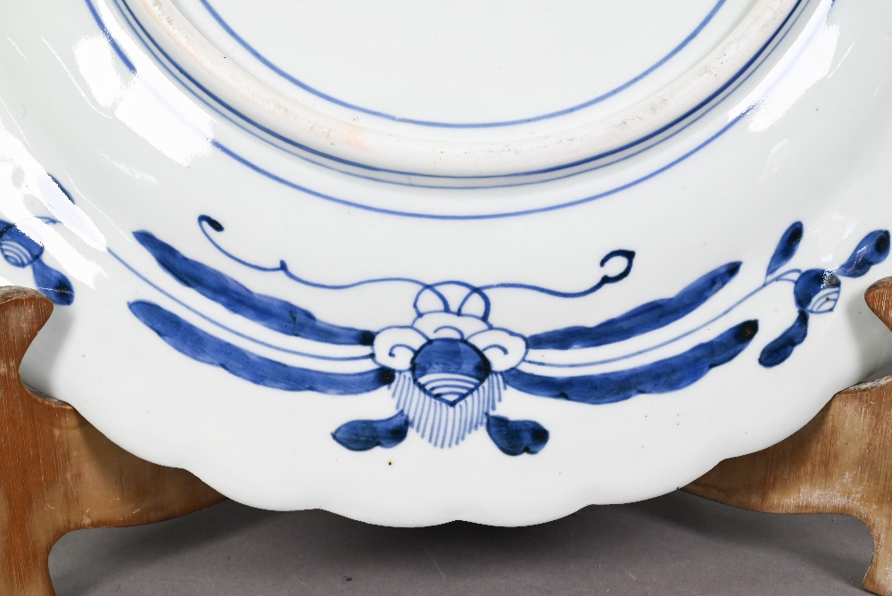 A 19th century Japanese blue and white floriform charger, painted with a goose and bamboo within a - Image 7 of 10