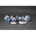 A small Chinese square wicker basket containing eleven Chinese 20th century blue and white painted