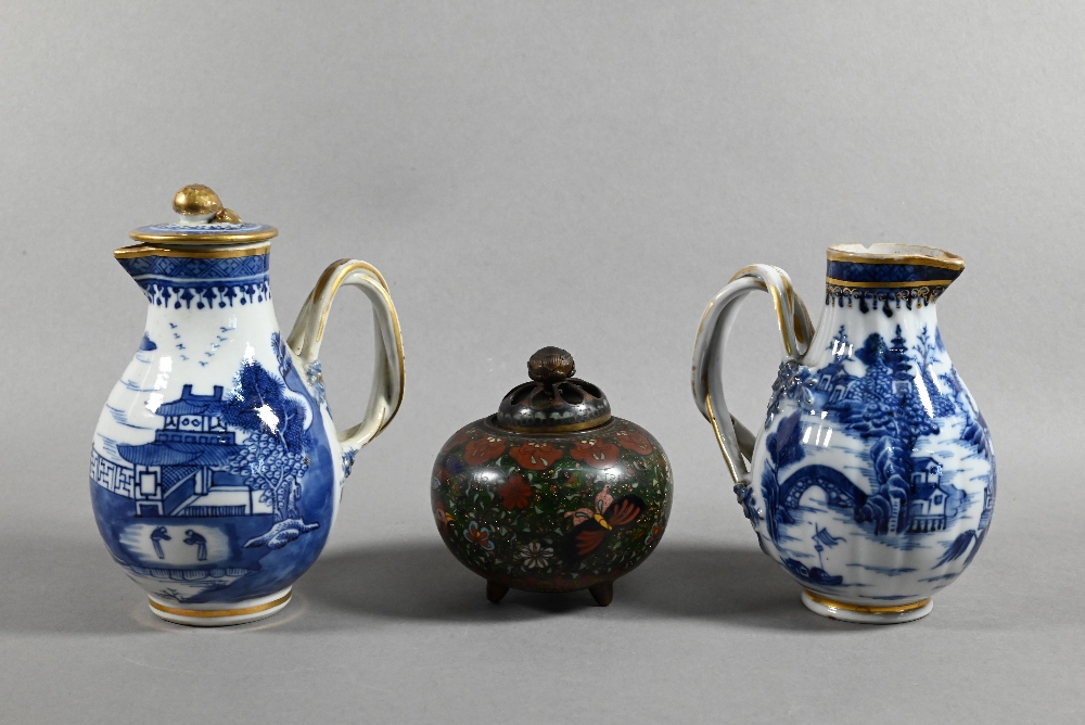 An 18th century Chinese export blue and white sparrow-beak jug and cover with moulded pomegranate