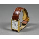 Must de Cartier vermeil (silver gilt) Tank wristwatch with 21 x 18 mm cream dial and cabochon