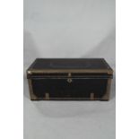 A 19th century brass studded black leather clad camphor-lined trunk, with brass handles to the